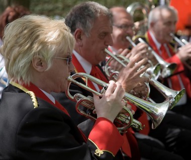 Musicians in a brass band perform during a country fair at Helmingham Hall, Suffolk, England,