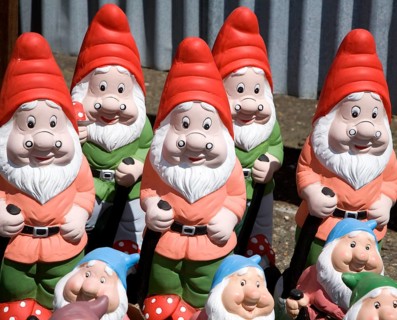 Colourful garden gnomes lined up for sale, UK