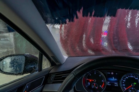 Car in an automatic car wash, car wash tunnel