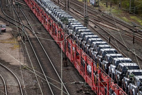 Freight train, car train with Landrover new cars on the goods train line at the Hagen-Vorhalle