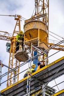 Concreting work on a construction site, new construction of a high-rise office building, facade of
