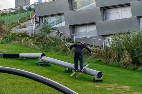 CopenHill, waste incineration plant and artificial ski slope, skiing with a view of the ski lift,