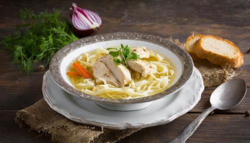 Food, a plate of chicken soup with noodles on a wooden table, AI generated, AI generated