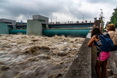 Weir of the Lake Baldeney in Essen, the masses of water roar through the open weirs, high water on
