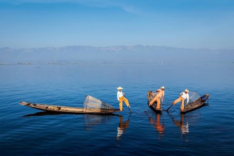 Myanmar travel attraction landmark, Traditional Burmese fishermen with fishing nets on boats at