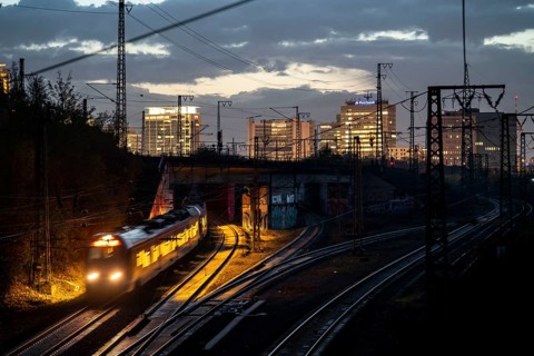 Skyline of Essen city centre, railway facilities in front of the main station, regional train,