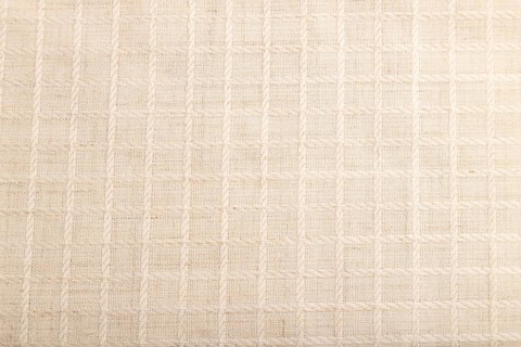 Fragment of smooth white linen tissue. Top view, flat lay, natural textile background and texture