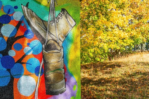 Graffito with hiking boots and trees with autumn foliage, Wiesenburg, International Art Trail,