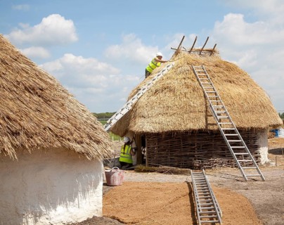 Buildings of replica Neolithic huts at the Stonehenge site, Wiltshire, England, UK