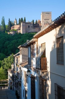Cuesta de la Victoria street in the Albaicin district, Granada, Spain view over to the Alhambra
