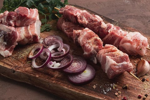 Raw pork meat, on wooden sticks, pickled kebab, with spices, top view, no people