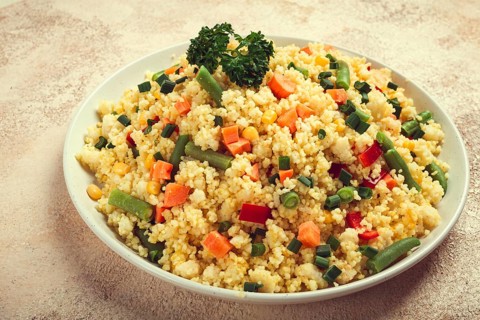 Couscous with vegetables, paprika, carrots, string beans, corn, homemade, top view, no people