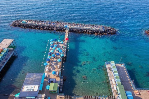 Bathing jetties below the cliffs, Sorrento, Sorrento Peninsula, Gulf of Naples, Campania, Italy,