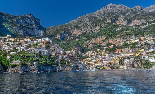 View from the boat of the village on the cliffs above the sea, Positano, Amalfi Coast, Amalfitana,