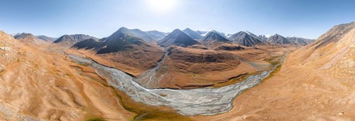 Aerial view, Burkhan mountain valley with meandering river, barren dramatic mountain landscape,