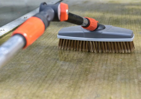 Clean patio roof, canopy with brush and telescopic handle, Germany, Europe
