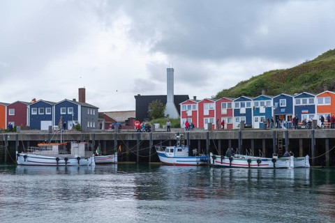 Colourful lobster shacks on the harbour promenade, Börteboote, offshore island of Heligoland, North