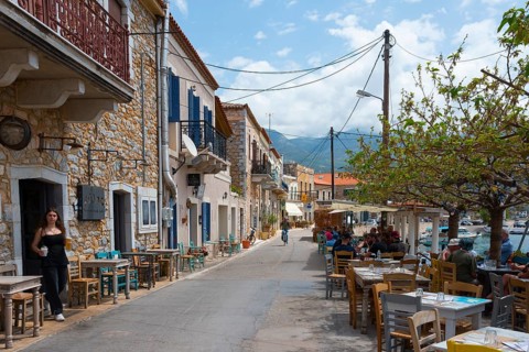 Mediterranean street with cafés and restaurants on a sunny coast, Agios Nikolaos, Mani, Messenia,