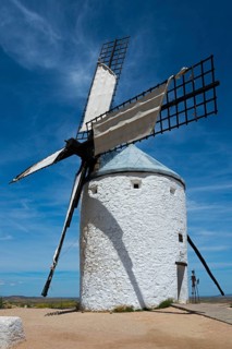 White windmill in a rural area with clear sky and few clouds, Consuegra, Toledo, Castilla-La