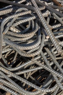 Pile of construction grade steel rods in metal recycling yard, Quebec, Canada, North America