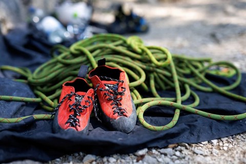 Special climbing shoes and a dynamic rope are part of the equipment for sport climbers on the rock.