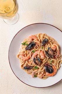 Spaghetti, pasta, with seafood, shrimp with mussels, in creamy garlic sauce, homemade, no people