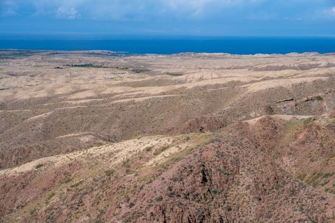 View of arid landscape and Issyk Kul Lake, Kyrgyzstan, Asia