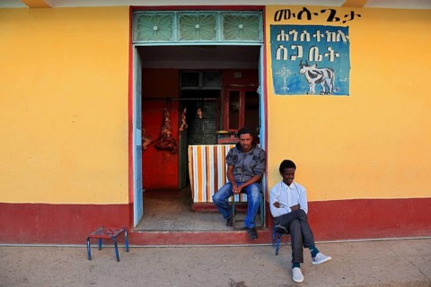 Aksum, Axum, owners sitting in front of their shop, Ethiopia, Africa