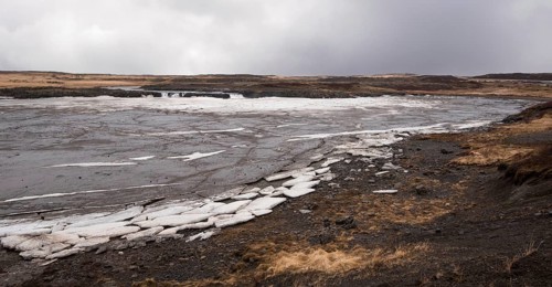 Typical Icelandic frozen lake with big ice cubes in the island of Iceland early in spring time