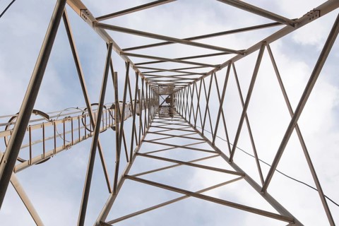 Metallic rusty structure of a telecommunication tower holding antennas for TV and radio