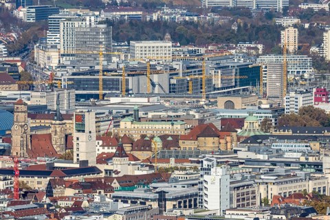 Central station with construction site Stuttgart 21, city centre with collegiate church, town hall