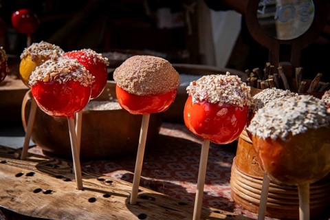 Yellow and red candied apples, medieval market, medieval week, former Hanseatic city of Visby,