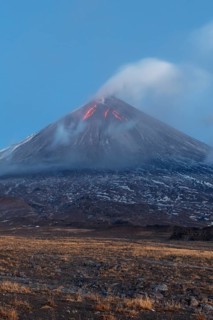 Volcanic landscape of Kamchatka: eruption Klyuchevskoy Volcano, lava flows on slope of volcano,