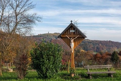Wayside shrine, Christ on the cross, autumn atmosphere, forest with foliage colouring, near