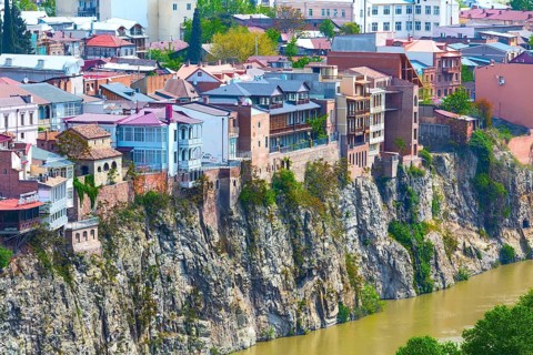 Tbilisi, Georgia, April 29, 2017: Aerial panoramic skyline with old traditional houses over Mtkvari