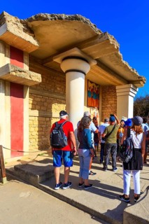Knossos, Greece, April 27, 2019: People visiting Crete landmark, ruins of Minoan Palace, Europe