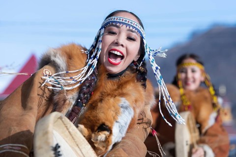 Female dancing with tambourine in national clothing indigenous inhabitants Kamchatka. Concert,