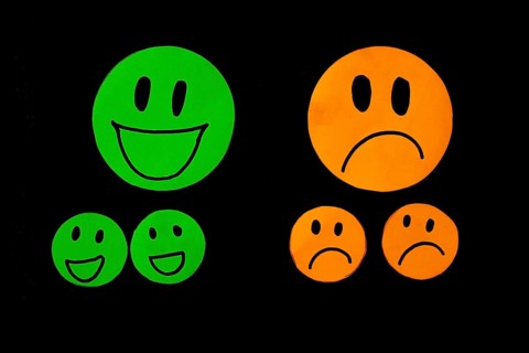 Set of smile and sadness emoticons isolated on black background. Line icons emoticons. Happy and