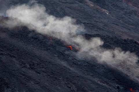Glowing lava on lava rock from Stromboli crater