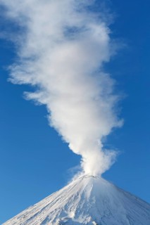 Winter volcanic landscape: active Klyuchevskaya Sopka (Klyuchevskoy Volcano), view of the top of