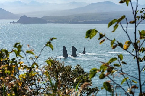 Stunning Kamchatka Peninsula seascape: top view of rocky mountain peak islands in sea, Three