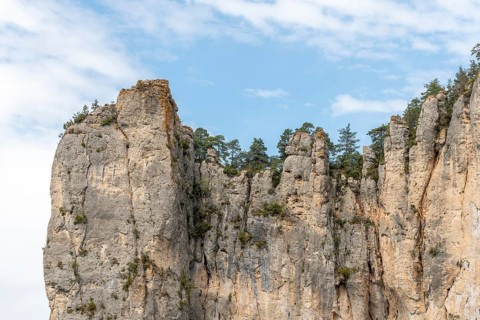 Big cliff seen from hiking trail on the corniches of Causse Mejean above the Tarn Gorges. La