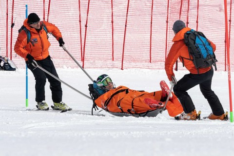 KAMCHATKA PENINSULA, RUSSIA, MAR 28, 2019: Rescuers Kamchatka Rescue Squad on alpine ski evacuate