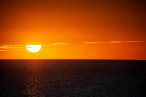 Texture of romantic setting sun with red sky