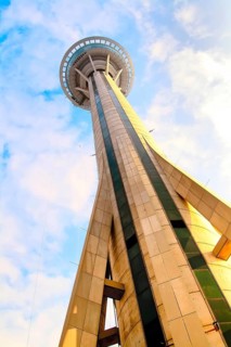 Macau Tower view against cloudy blue sky