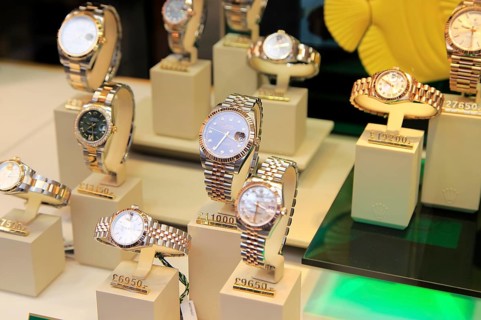 Winsor Bishop jewellery shop window display of expensive Rolex watches, Norwich, Norfolk, England,