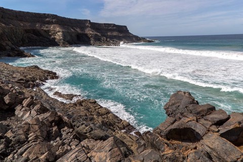 Waves breaking in a small bay near Los Molinos, west coast of Fuerteventura, Canary Islands, Spain,