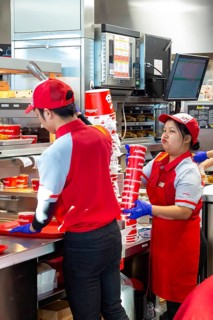 Sterling Heights, Michigan, Workers serve up Chickenjoy fried chicken at Jollibee, a Filipino fast