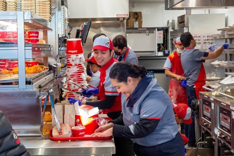 Sterling Heights, Michigan, Workers serve up Chickenjoy fried chicken at Jollibee, a Filipino fast