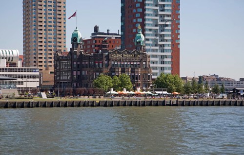 Historic Hotel New York building dwarfed by modern skyscrapers, Rotterdam, Netherlands